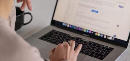 crop unrecognizable businesswoman typing on laptop at home