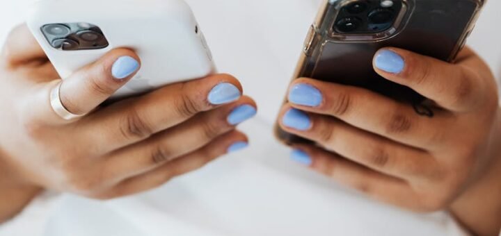 close up shot of a person holding smartphones