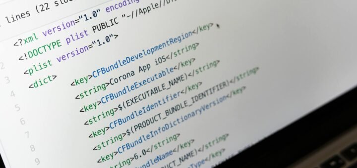 Detailed view of XML coding on a computer screen, showcasing software development.