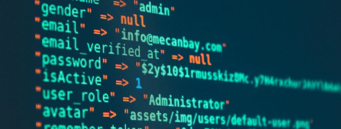 Vibrant close-up of code displayed on a monitor with various programming details.
