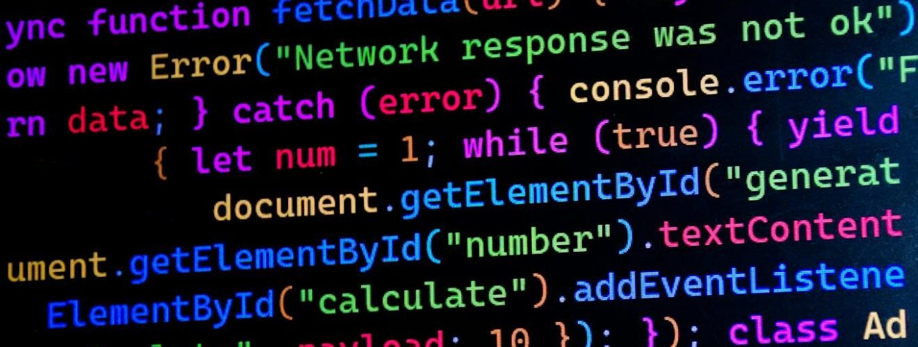 Close-up of colorful JavaScript code displayed on a computer monitor, ideal for tech-themed projects.