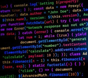 Close-up of colorful JavaScript code displayed on a computer monitor, ideal for tech-themed projects.