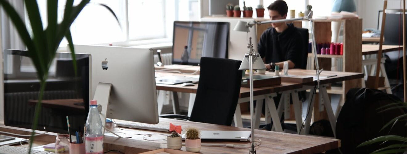 Open-plan office with modern decor and natural lighting, ideal for productivity.