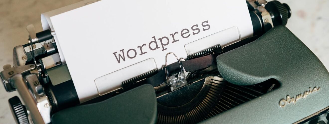 Close-up of a vintage typewriter with paper labeled Wordpress.