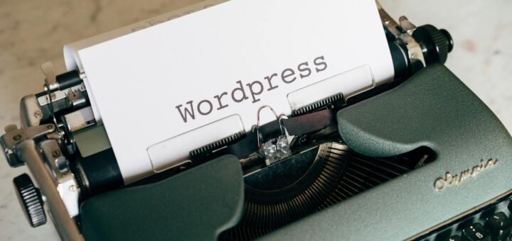 Close-up of a vintage typewriter with paper labeled Wordpress.