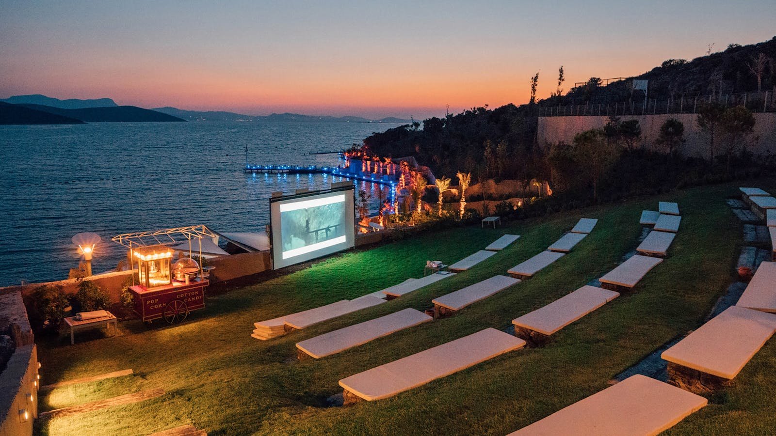 Beautiful evening outdoor movie setup by the sea in Bodrum, Turkey.