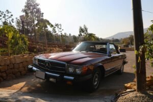 Vintage Mercedes-Benz parked outdoors in Amman, Jordan, on a sunny day.