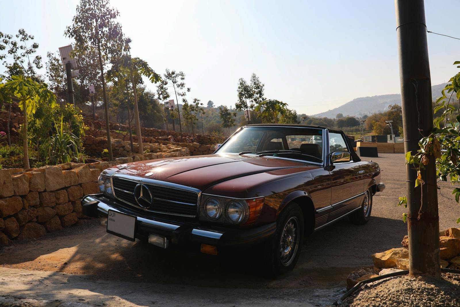 Vintage Mercedes-Benz parked outdoors in Amman, Jordan, on a sunny day.