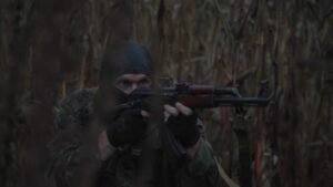 a man with a gun in his hand