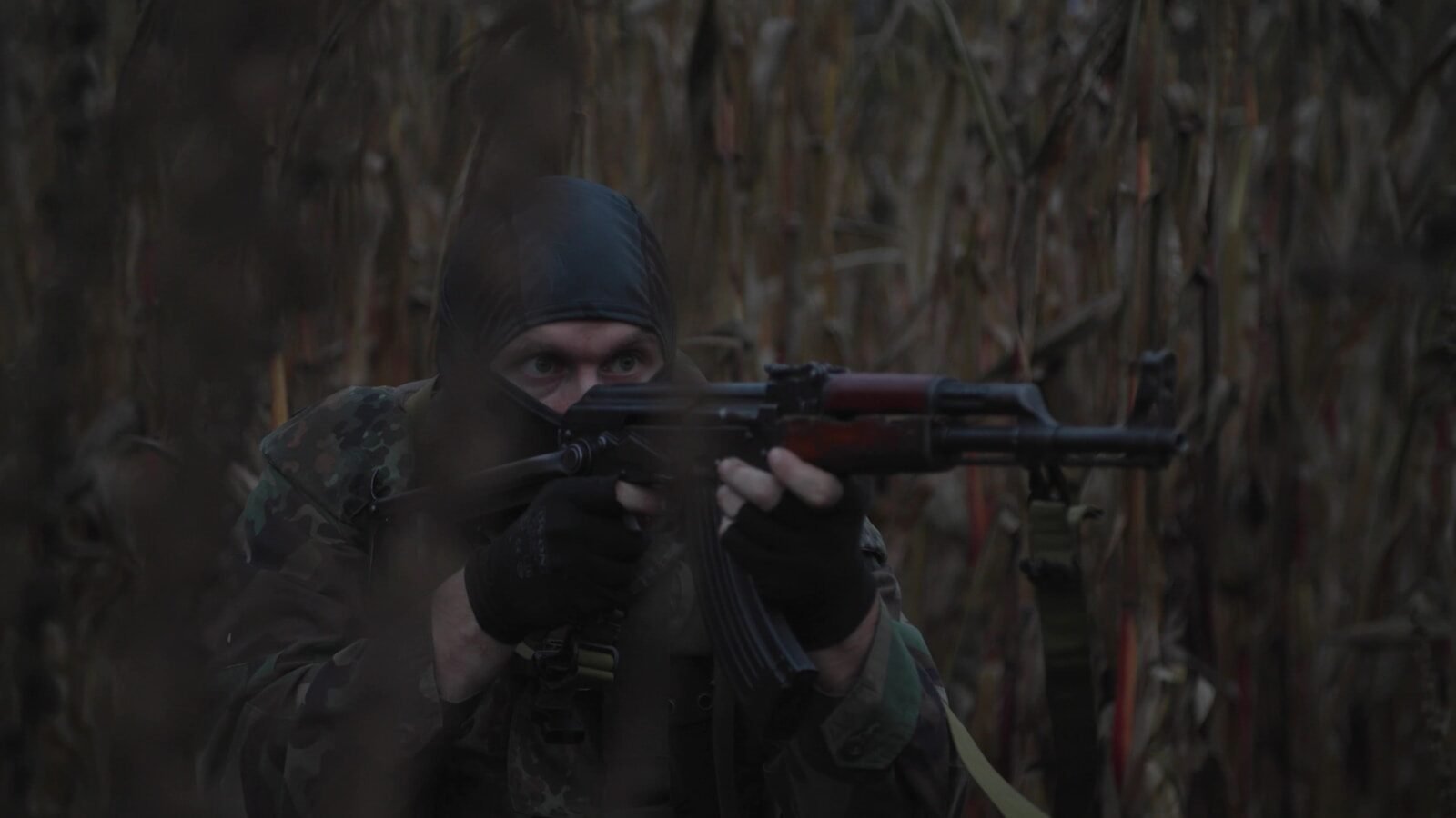 a man with a gun in his hand