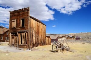 brown wooden house under white clouds