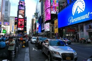 Busy street with cars and bright billboards in times square