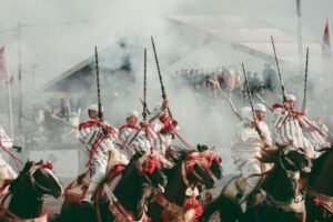 A group of men riding on the backs of horses